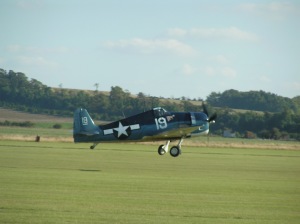 TFC's Hellcat G-BTCC getting airborne at Duxford. 