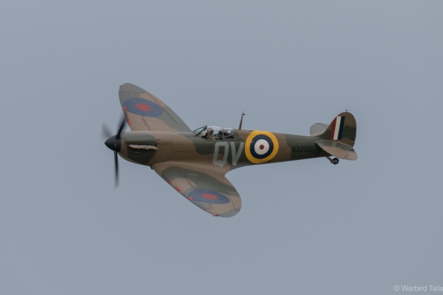 The Spitfire flies past during its display. 